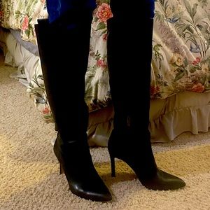 High heeled black leather boots